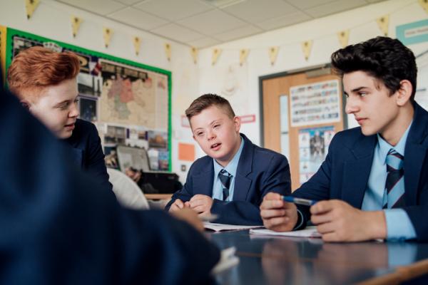 school boys sitting at desk