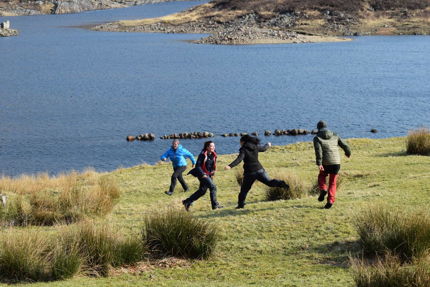Family having fun by a loch