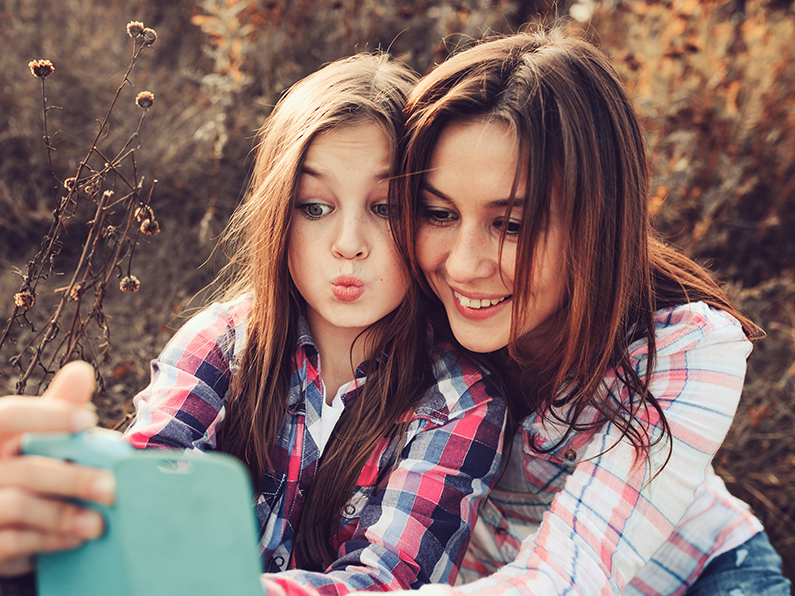 Mum and daughter taking selfie