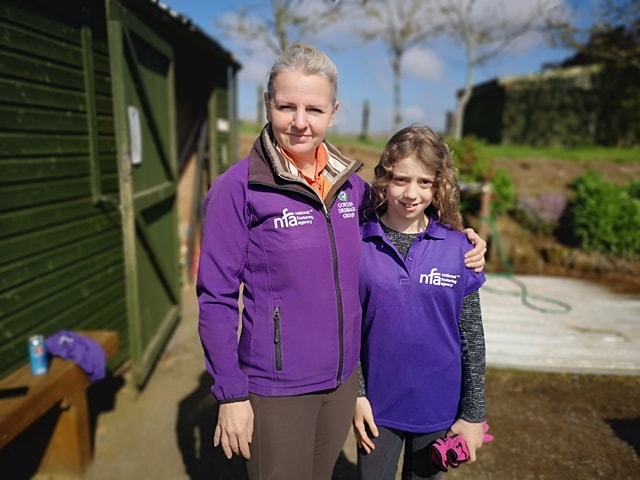 Nicky Heale with looked-after child at the livery