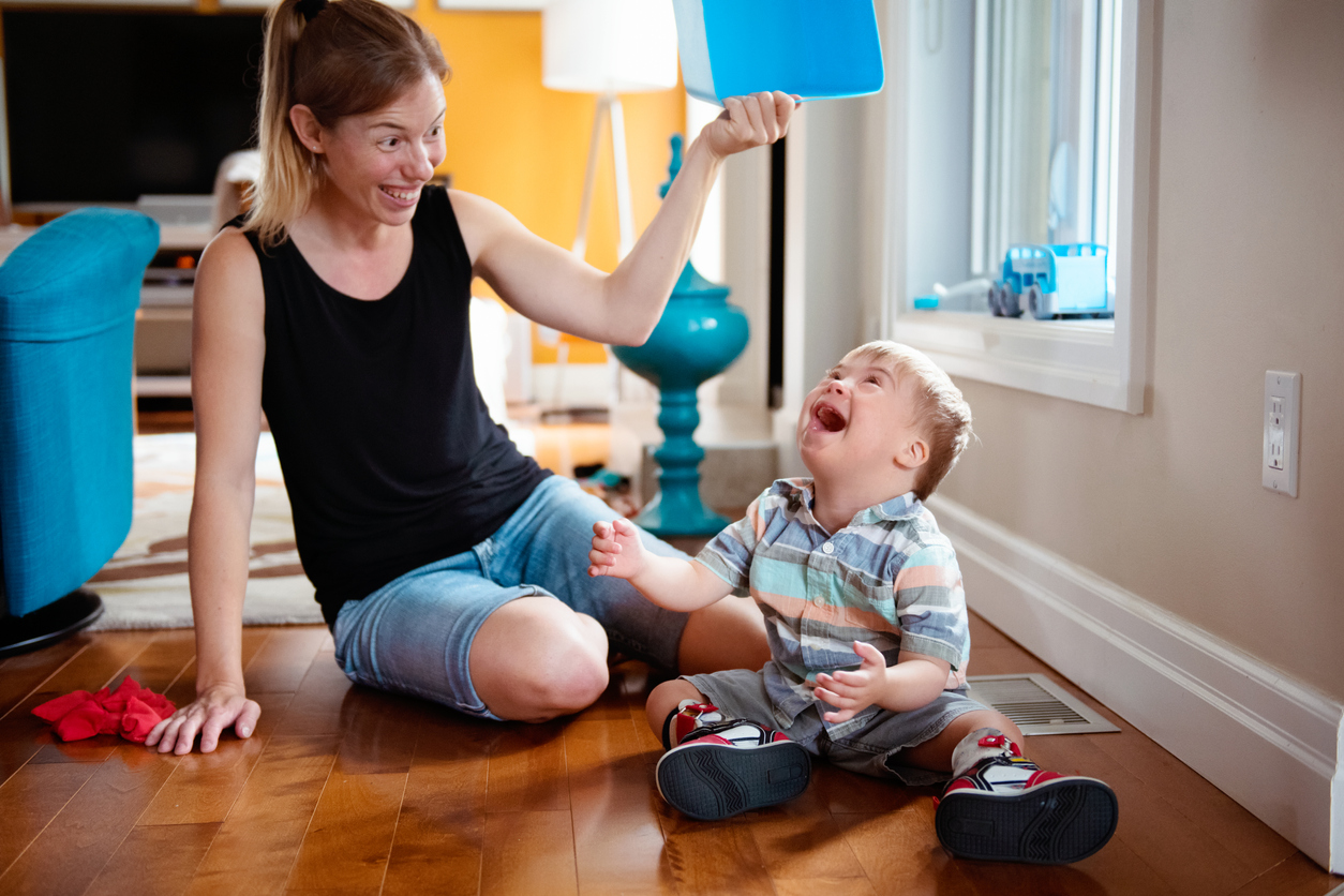 Child with Down Syndrome playing with orthopedic device