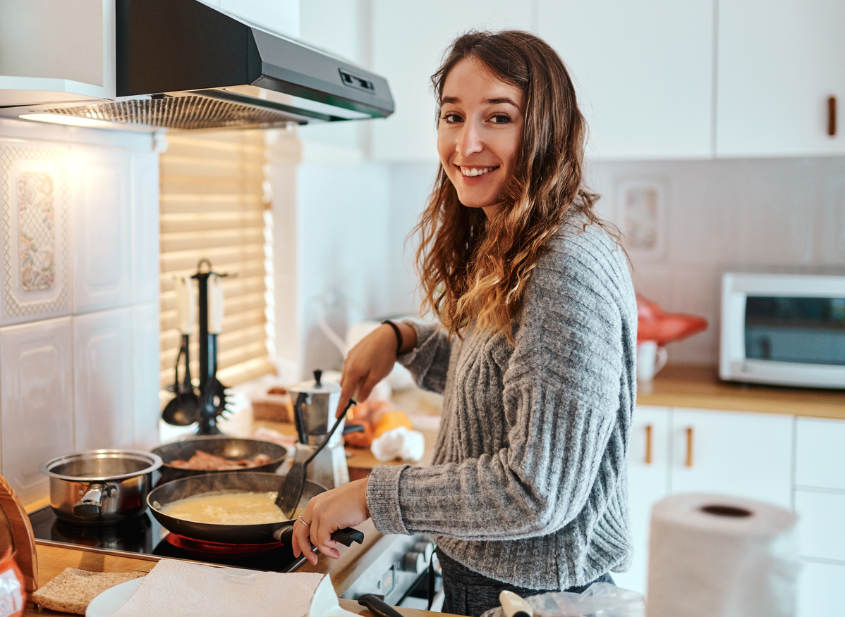 Teenager (foster child) cooking a meal