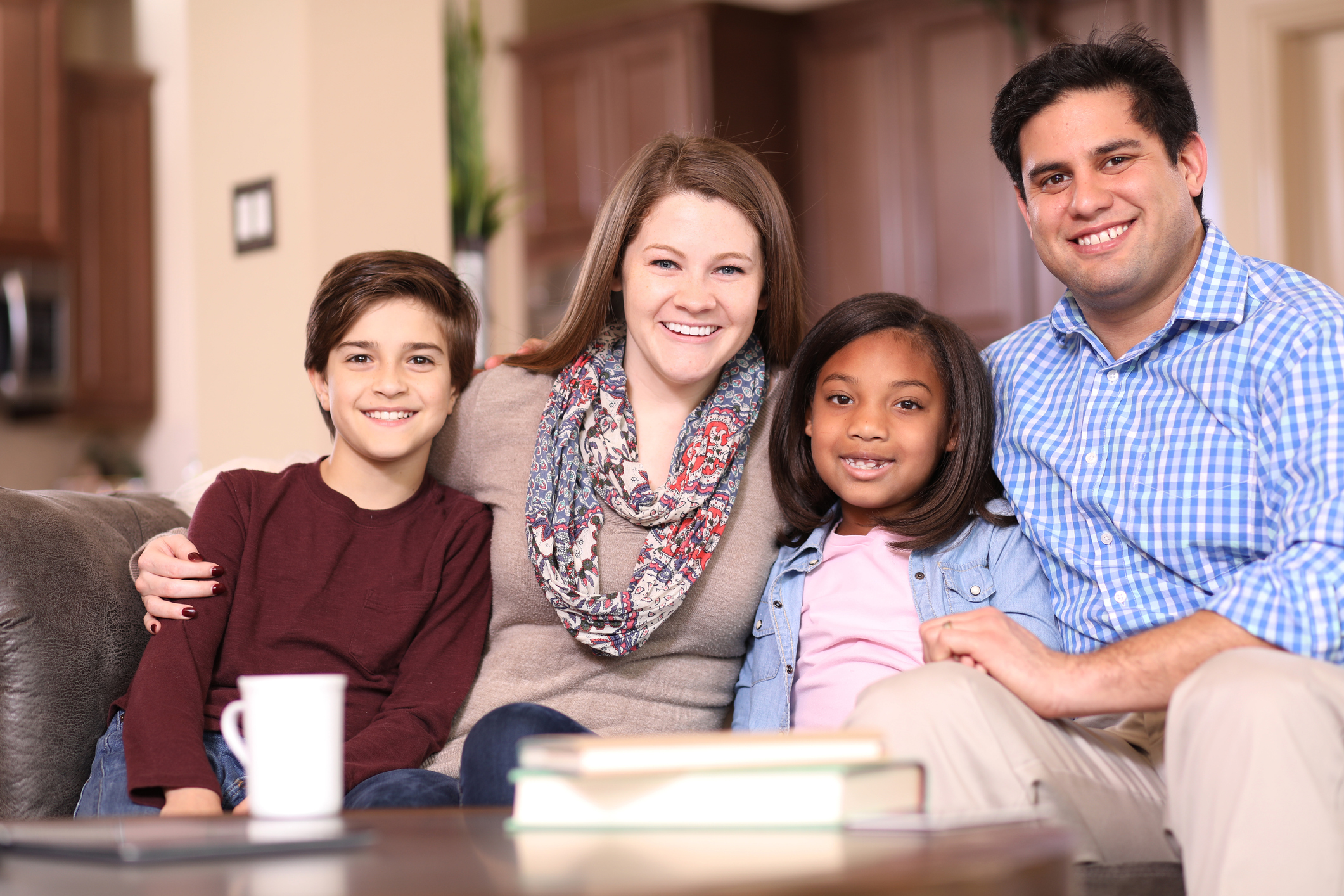 Multi-ethnic, adoption or foster care family at home.