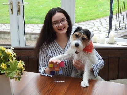 foster care user with award and dog