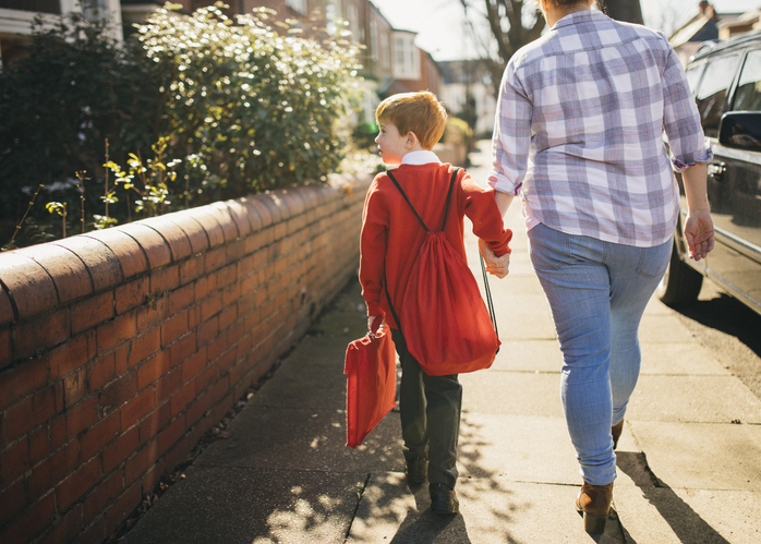foster carer walking child to school