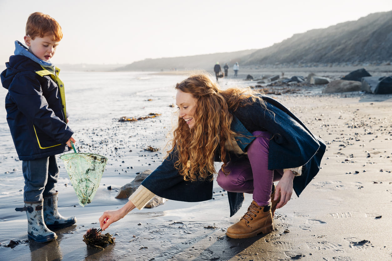 Woman and boy on beach