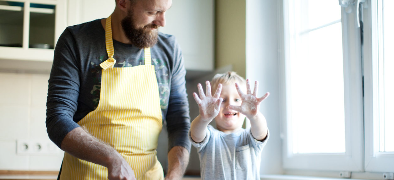 Foster carer cooking with foster son