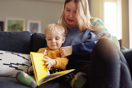 woman reading with boy