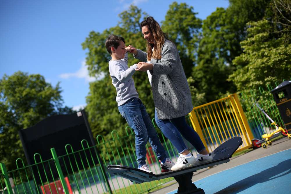 Foster child and foster parent on a seesaw