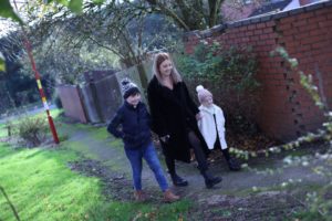 Foster mum, walking with her son and foster daughter.