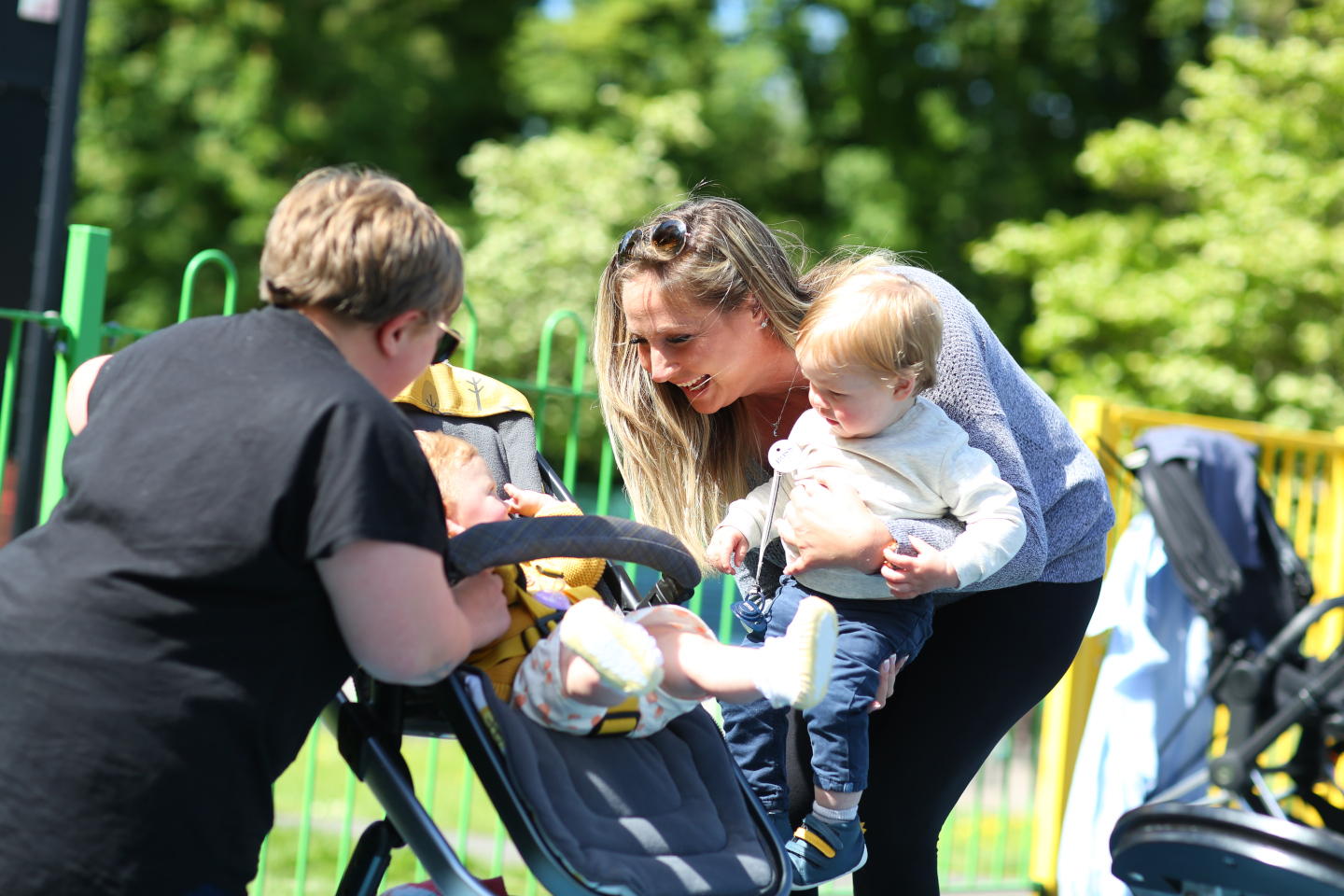 Child and foster parents in the park